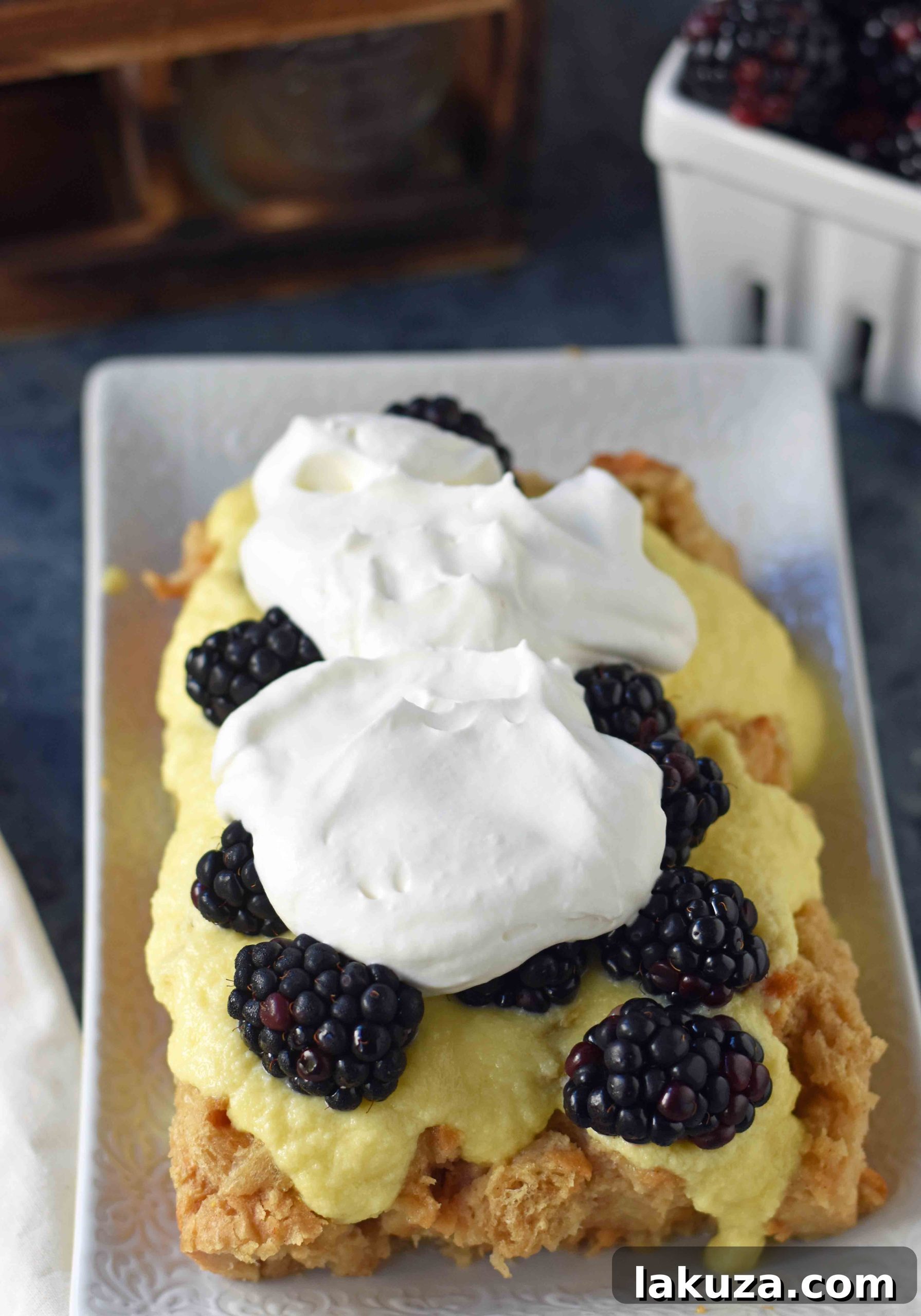 Decadent Blackberry Bread Pudding 5 Blackberry Bread Pudding made with french bread soaked in vanilla custard, baked, and topped with creme anglaise sauce, freshly whipped cream, and fresh blackberries. A warm and comforting bread pudding dessert. www.modernhoney.com
