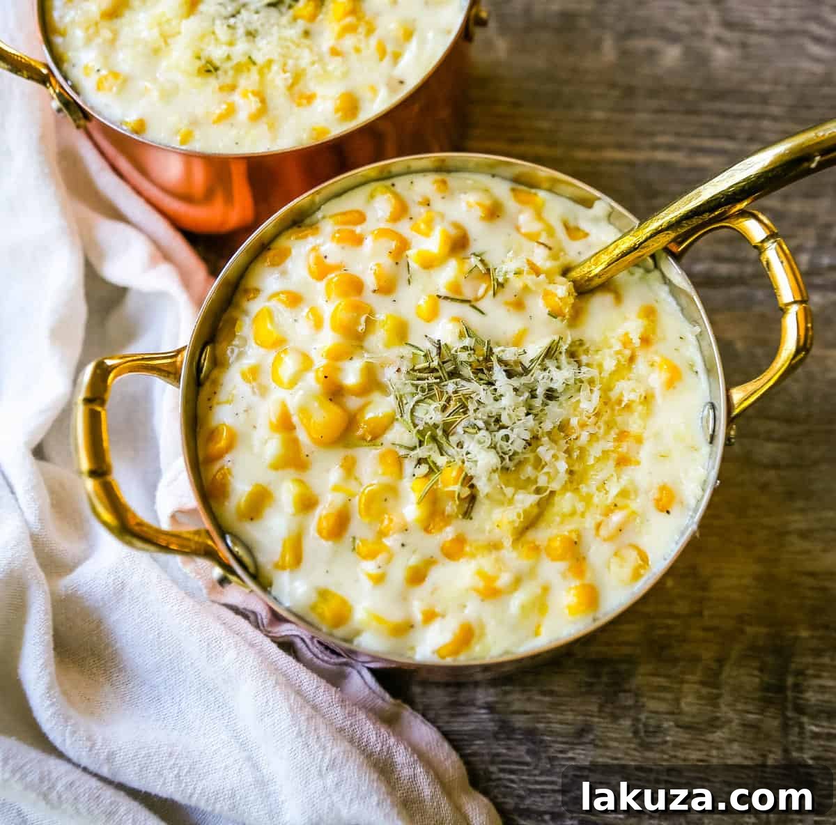 Creamed Corn is made with corn, fresh cream, butter, parmesan cheese, and salt. This is the best creamed corn recipe! We serve this every Thanksgiving and it is the most popular side dish at the table.