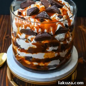 This Salted Caramel Brownie Cheesecake Trifle is made layers of rich, fudgy brownies, creamy cheesecake filling, salted caramel, homemade whipped cream, and chocolate covered caramels. This is the perfect sweet dessert to impress your guests and is such a crowd pleaser!