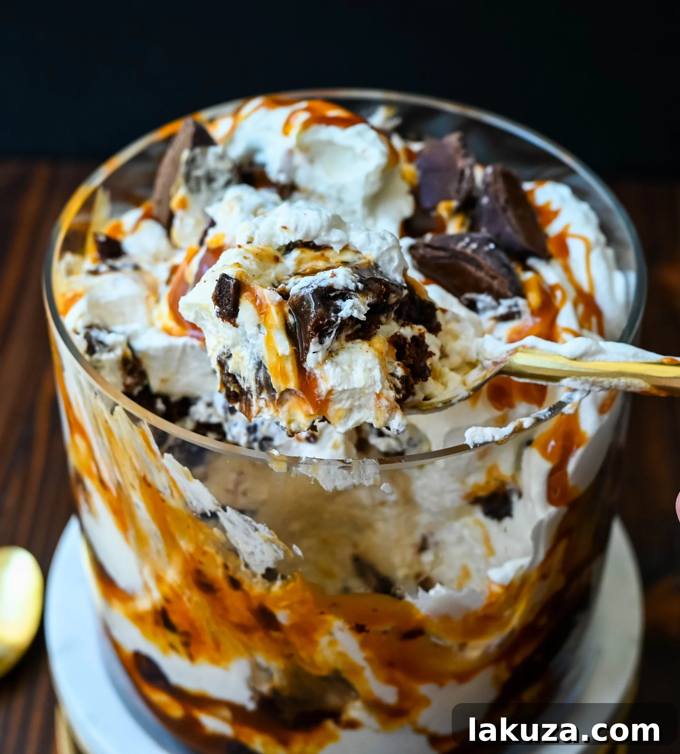 This Salted Caramel Brownie Cheesecake Trifle is made layers of rich, fudgy brownies, creamy cheesecake filling, salted caramel, homemade whipped cream, and chocolate covered caramels. This is the perfect sweet dessert to impress your guests and is such a crowd pleaser!