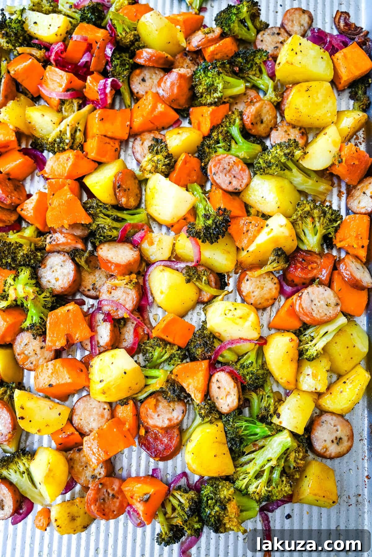 Effortless Sheet Pan Chicken Sausage and Roasted Vegetables 2 This Sheet Pan Chicken Sausage and Veggies Recipe is made with savory chicken sausage nestled between caramelized, crispy-edged vegetables, all roasted to perfection on a single sheet pan. It's quick, effortless, so delicious, and perfect for busy weeknights or cozy, family-style dinners.