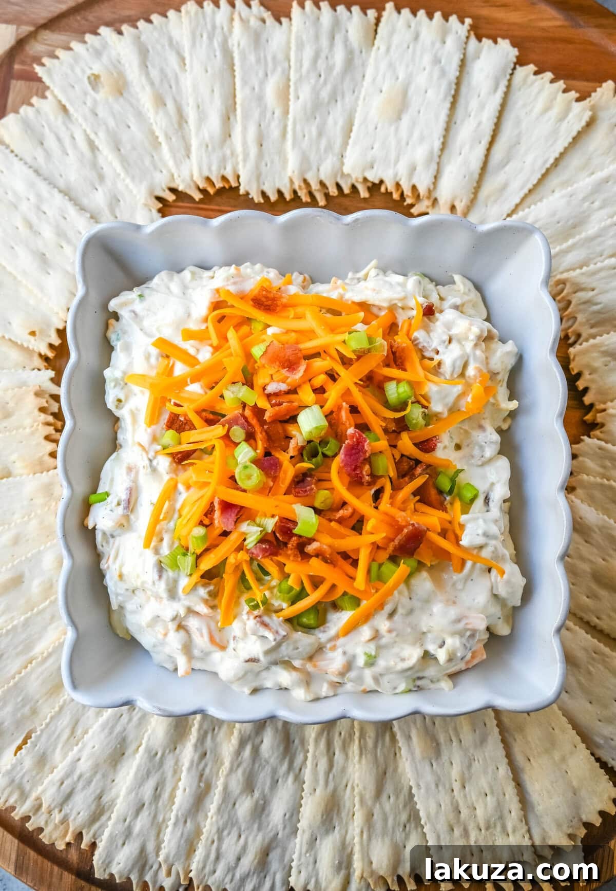 Crack Dip, also known as Million Dollar Dip, is a creamy, addictive party favorite made with a few simple and flavorful ingredients. The combination of cream cheese, cheddar, parmesan, bacon, ranch seasoning, and even jalapenos creates a combo that people can’t stop eating, which explains its catchy nickname—Crack Dip. Whether you're hosting a game night, family gathering, or looking for an easy, crowd-pleasing snack, this dip is bound to be a hit. 