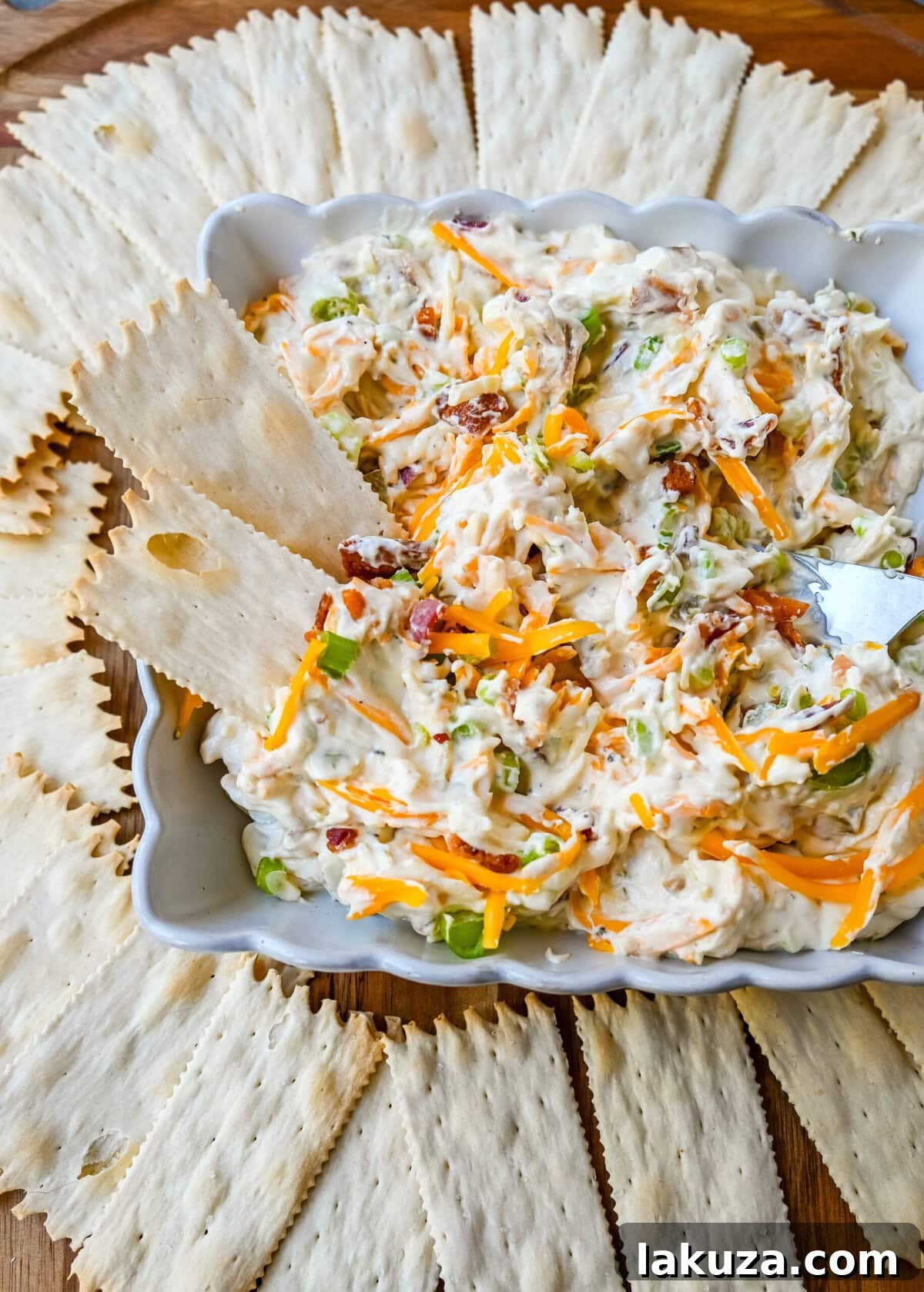 Crack Dip, also known as Million Dollar Dip, is a creamy, addictive party favorite made with a few simple and flavorful ingredients. The combination of cream cheese, cheddar, parmesan, bacon, ranch seasoning, and even jalapenos creates a combo that people can’t stop eating, which explains its catchy nickname—Crack Dip. Whether you're hosting a game night, family gathering, or looking for an easy, crowd-pleasing snack, this dip is bound to be a hit. 