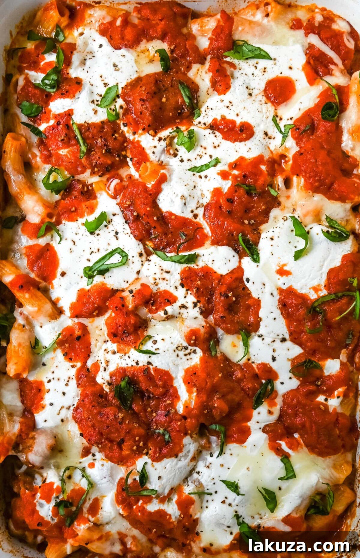 Hearty Baked Italian Sausage Rigatoni 4 Ingredients for Baked Rigatoni with Sausage laid out on a counter.