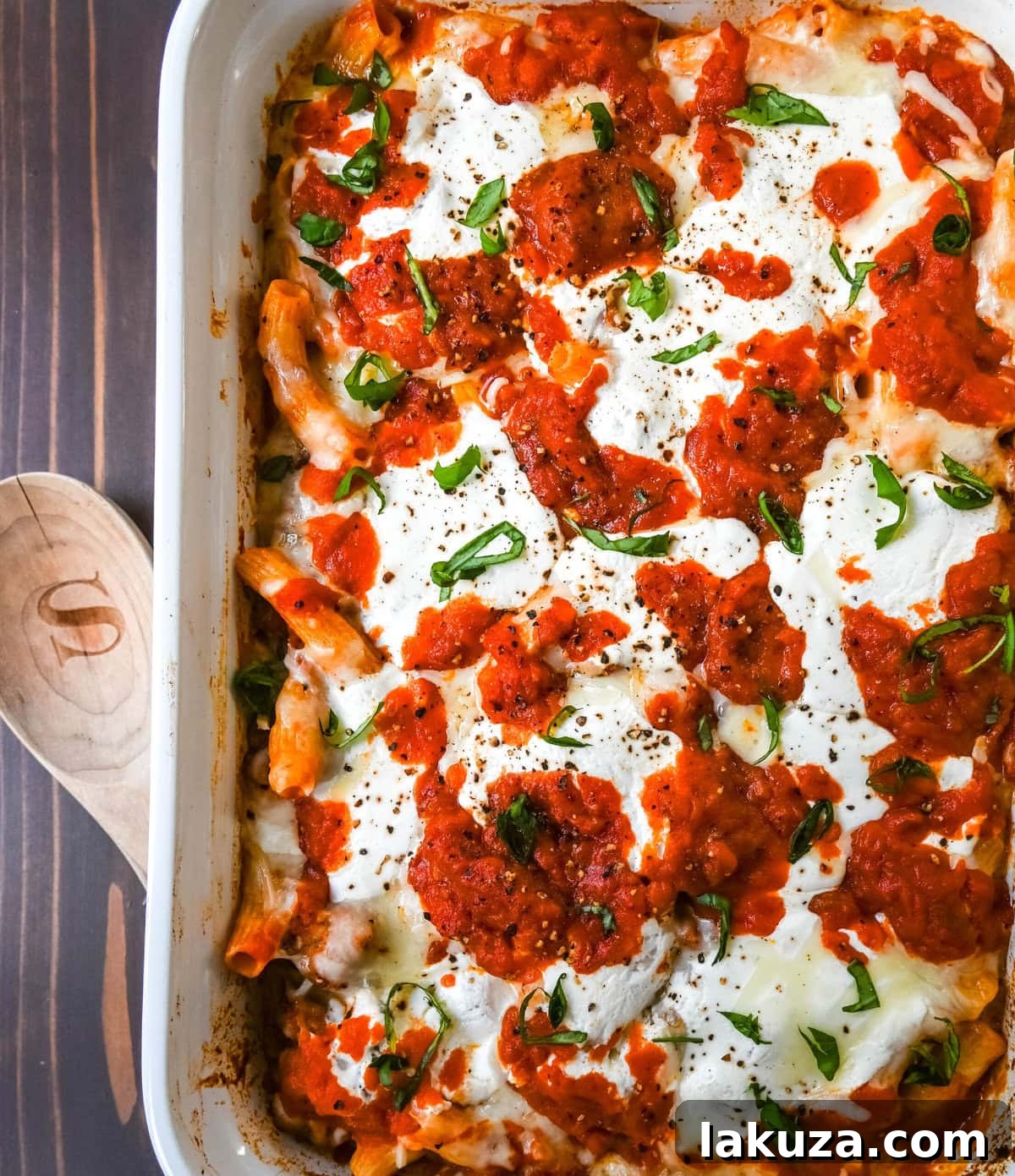 Hearty Baked Italian Sausage Rigatoni 5 A serving of Baked Rigatoni with Sausage garnished with fresh basil.