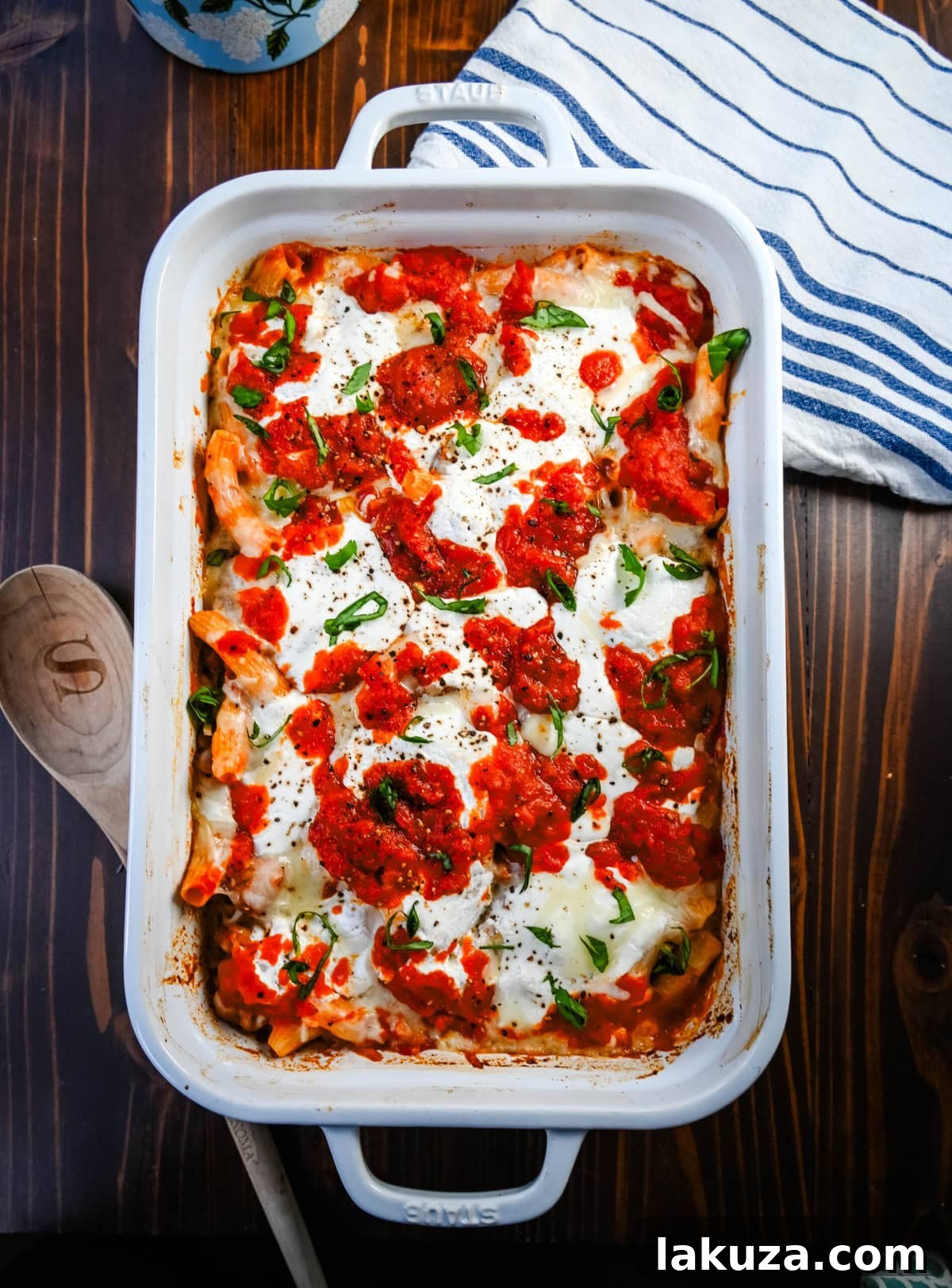 Hearty Baked Italian Sausage Rigatoni 6 Overhead shot of Baked Rigatoni with Sausage in a baking dish, garnished.
