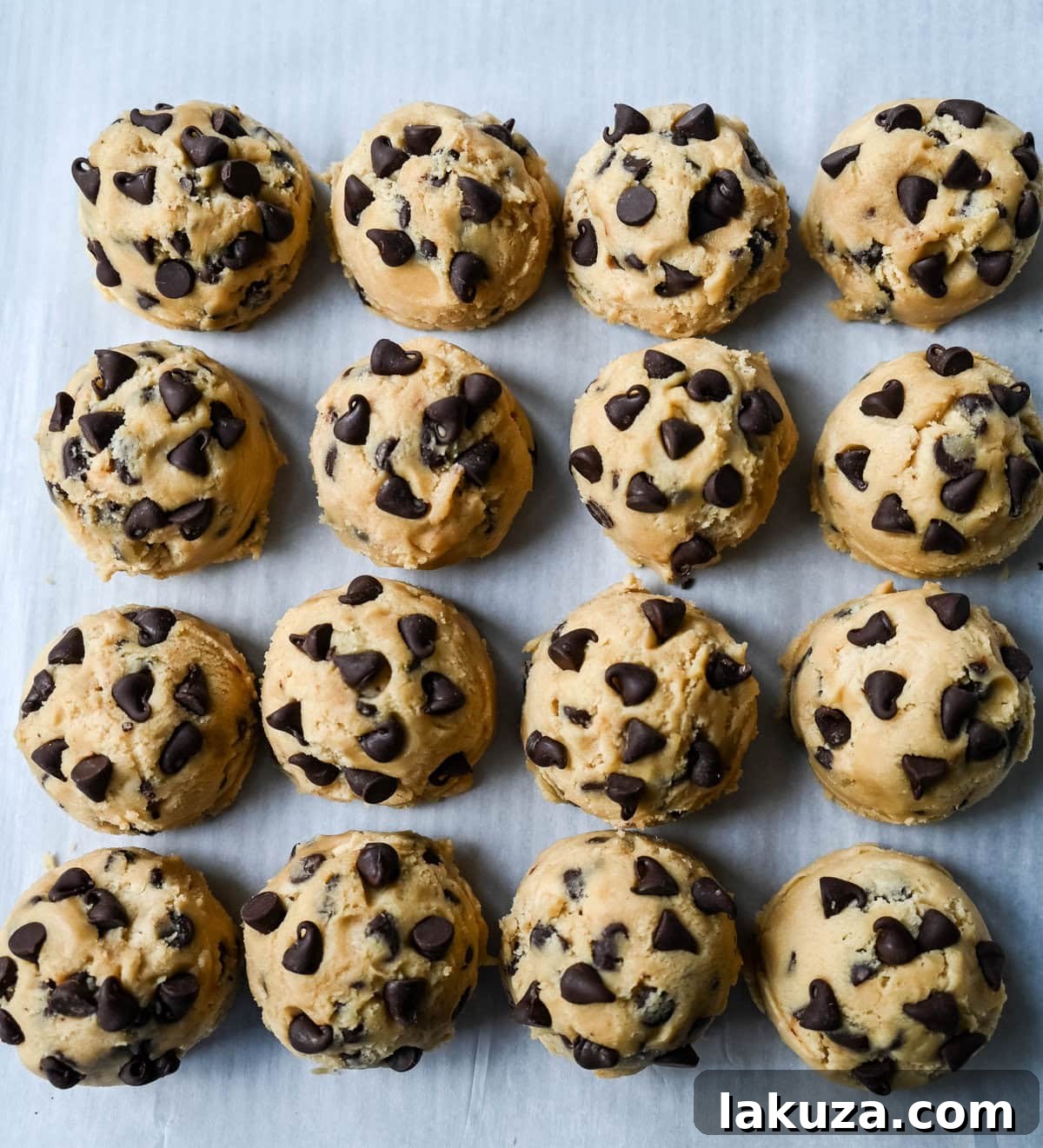 Two separate bowls of chocolate chip cookie dough, one lighter in color from generic ingredients, the other richer from premium ingredients, waiting to be chilled.