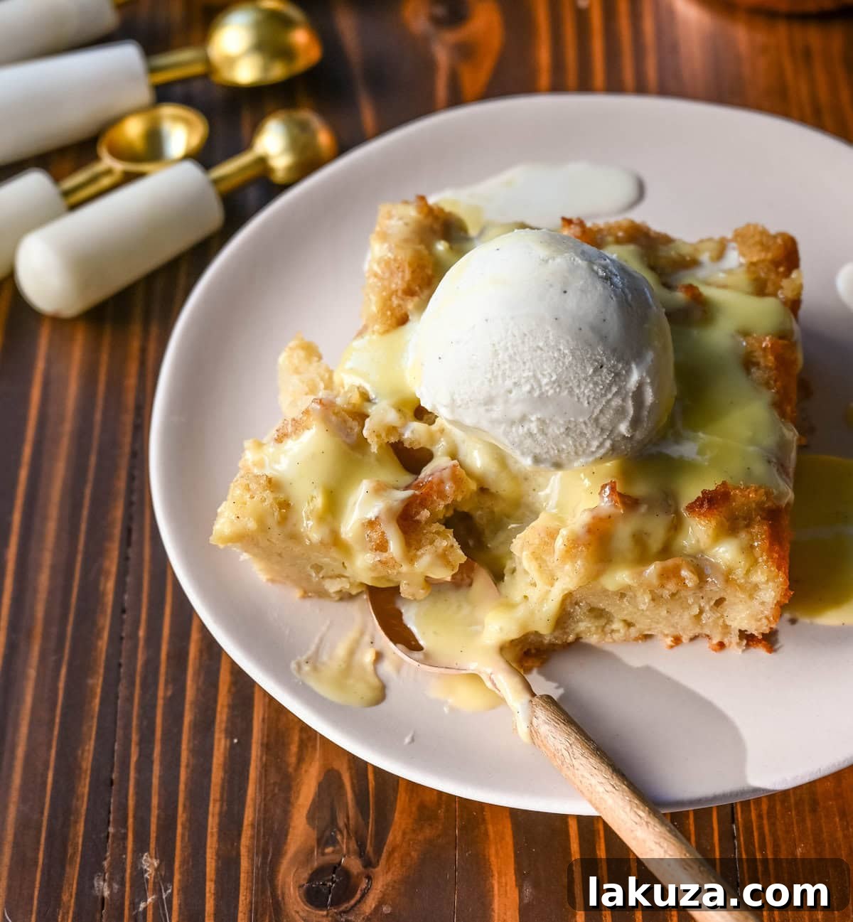 The best bread pudding recipe, an ultimate comfort dessert, featuring smooth vanilla bean custard absorbed by rich, day-old bread. Enhanced with warm spices and vanilla for creamy texture, topped with a crisp, golden crust. Served with homemade creme anglaise sauce and fresh whipped cream, it's the perfect comfort food dessert!