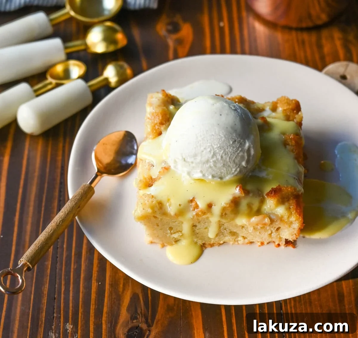 The best bread pudding recipe, an ultimate comfort dessert, featuring smooth vanilla bean custard absorbed by rich, day-old bread. Enhanced with warm spices and vanilla for creamy texture, topped with a crisp, golden crust. Served with homemade creme anglaise sauce and fresh whipped cream, it's the perfect comfort food dessert!