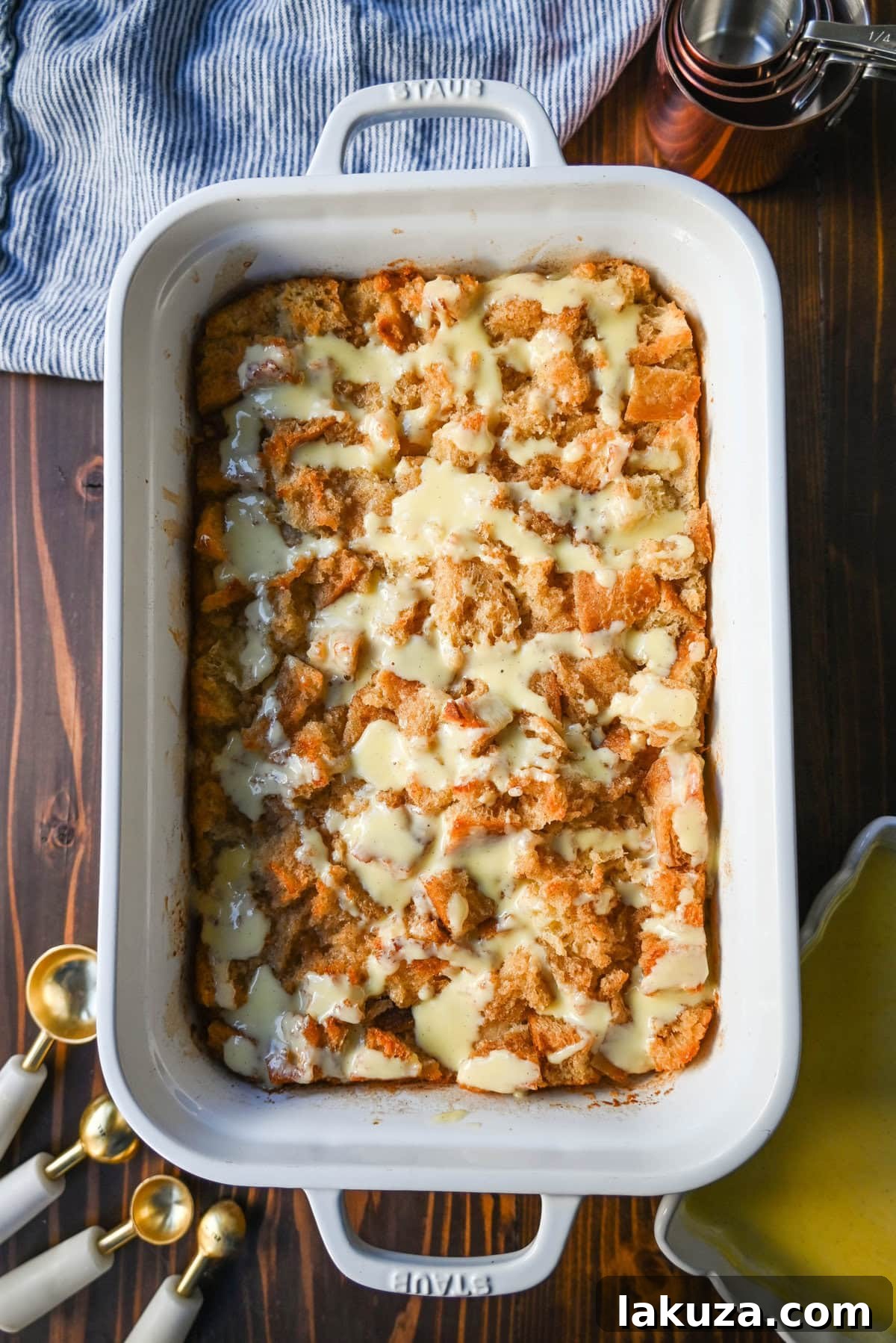The best bread pudding recipe, an ultimate comfort dessert, featuring smooth vanilla bean custard absorbed by rich, day-old bread. Enhanced with warm spices and vanilla for creamy texture, topped with a crisp, golden crust. Served with homemade creme anglaise sauce and fresh whipped cream, it's the perfect comfort food dessert!