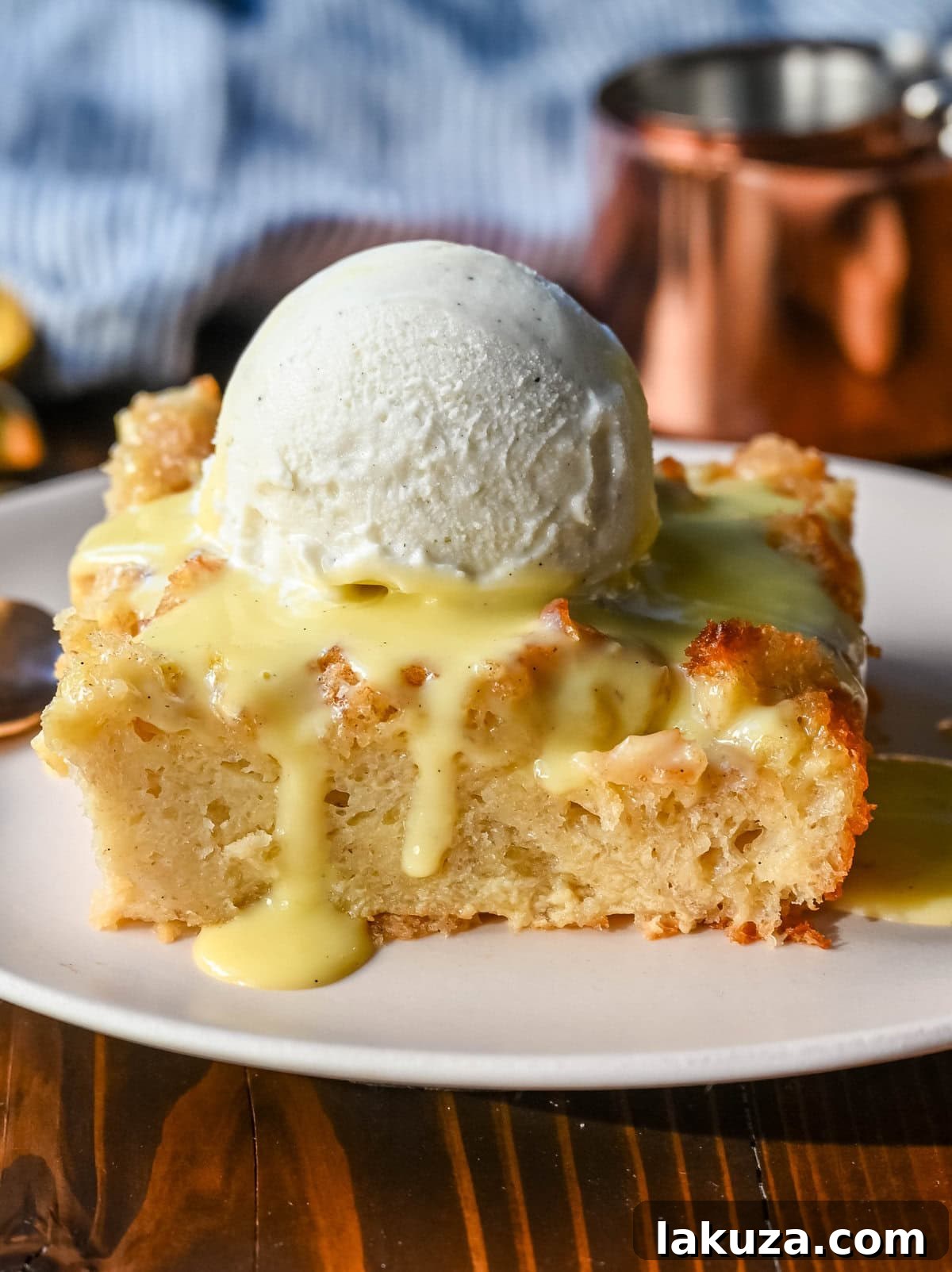 The best bread pudding recipe, an ultimate comfort dessert, featuring smooth vanilla bean custard absorbed by rich, day-old bread. Enhanced with warm spices and vanilla for creamy texture, topped with a crisp, golden crust. Served with homemade creme anglaise sauce and fresh whipped cream, it's the perfect comfort food dessert!