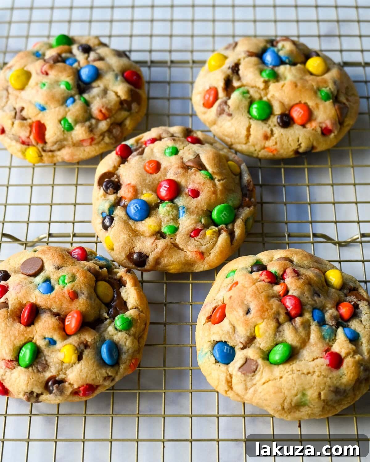 M&M Nutella Volcano Cookies 11 A single M&M Nutella Stuffed Cookie with a bite taken out, revealing the gooey Nutella filling.