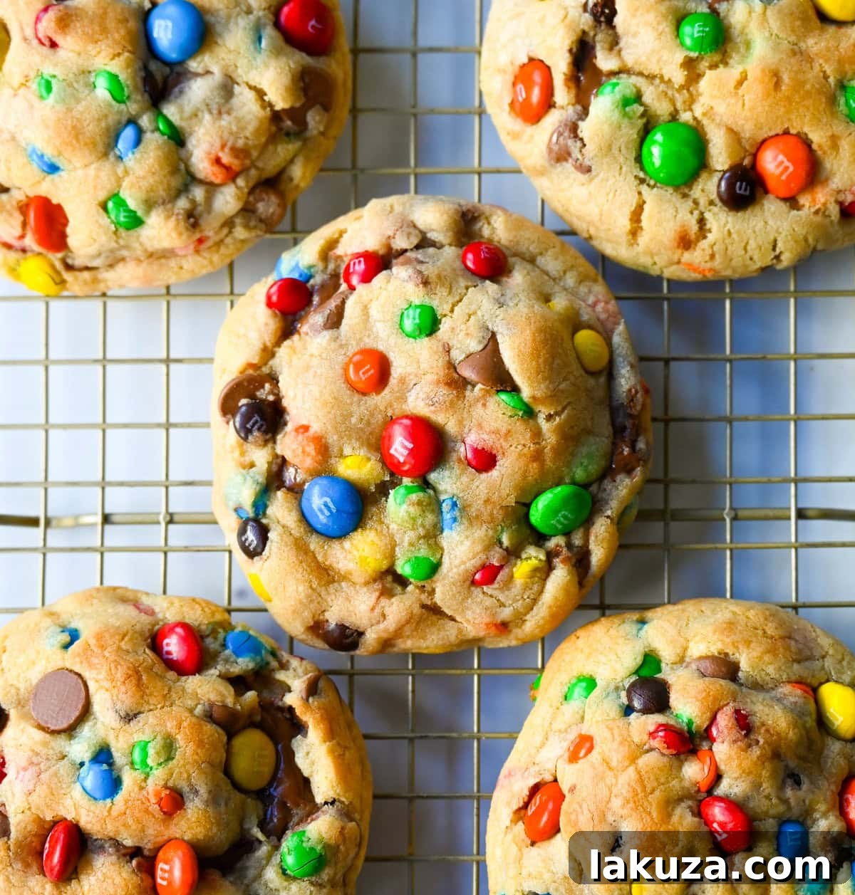 M&M Nutella Volcano Cookies 12 A stack of three M&M Nutella Lava Cookies, with the top one revealing its molten Nutella core.