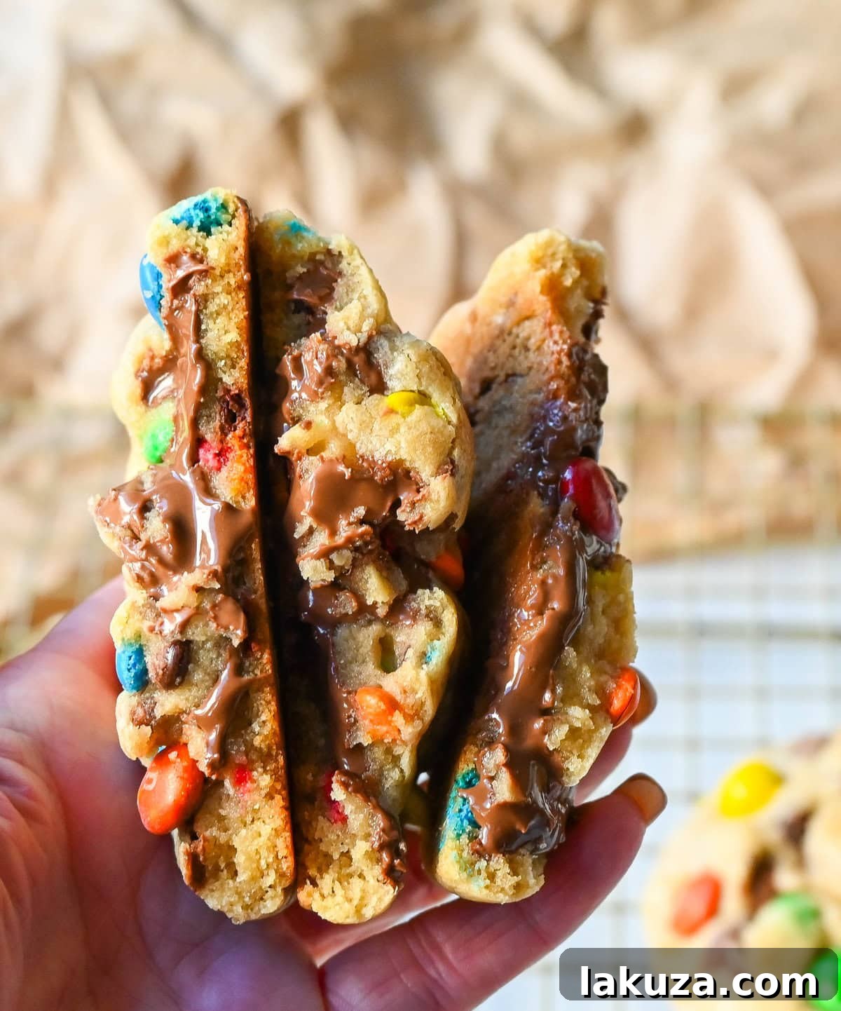 M&M Nutella Volcano Cookies 10 A freshly baked M&M Nutella Stuffed Cookie, showcasing its vibrant M&M's and soft texture.