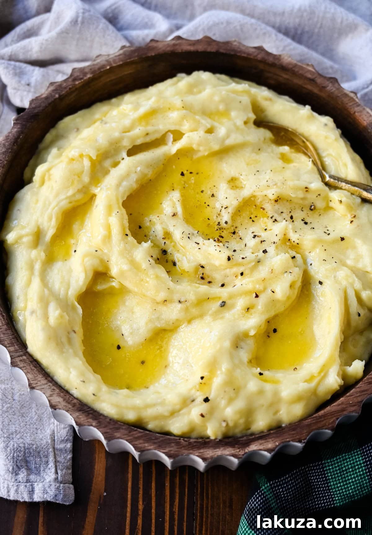 Delicious Browned Butter Mashed Potatoes in a bowl with a spoon.