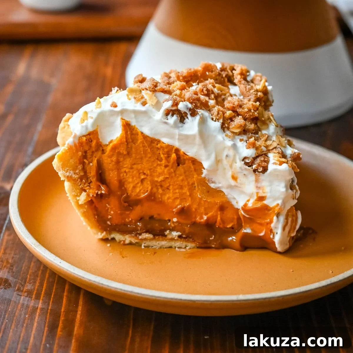 Golden Harvest Hillys Pumpkin Caramel Pie 13 A beautifully set Milk Bar Pumpkin Caramel Pie, topped with elegant swirls of whipped cream and crunchy streusel.