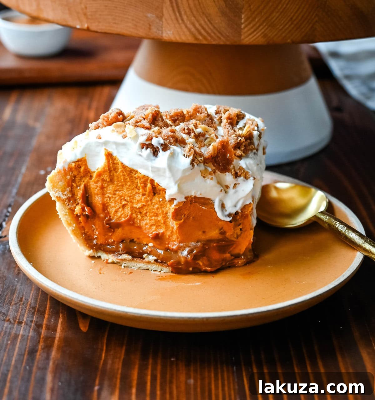 Golden Harvest Hillys Pumpkin Caramel Pie 14 A glorious wide shot of Milk Bar Pumpkin Caramel Pie, featuring a rich, dark caramel layer at the base.