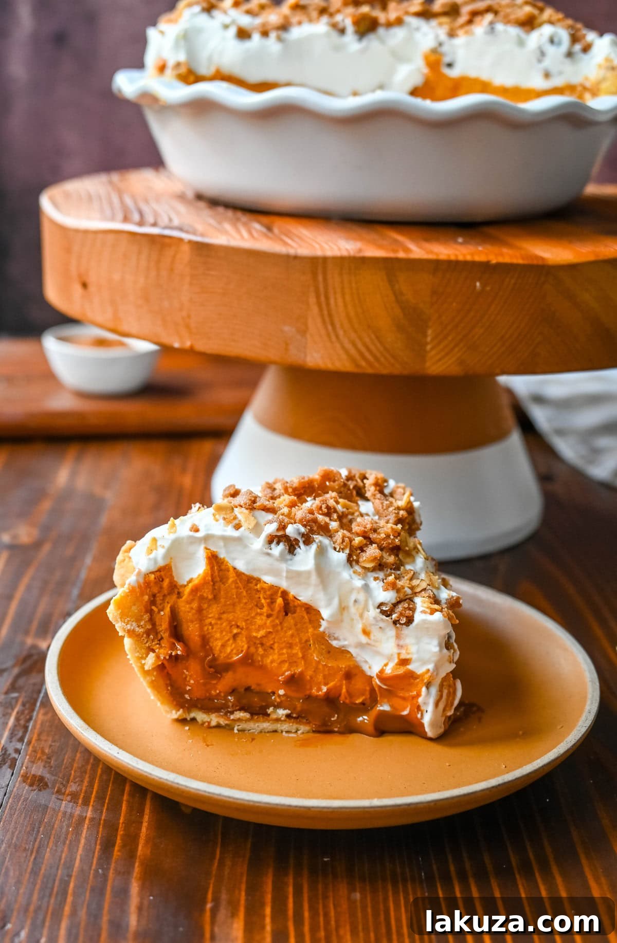 Golden Harvest Hillys Pumpkin Caramel Pie 15 Full Milk Bar Pumpkin Caramel Pie with festive holiday decorations, ready for a gathering.