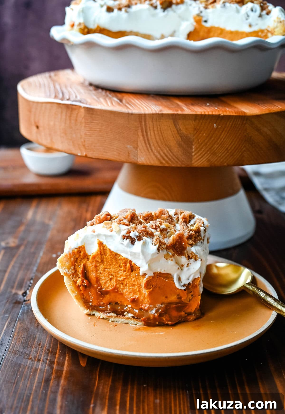 Golden Harvest Hillys Pumpkin Caramel Pie 3 Close-up of the beautiful, multi-layered Milk Bar Pumpkin Caramel Pie, ready to be served for a special occasion.