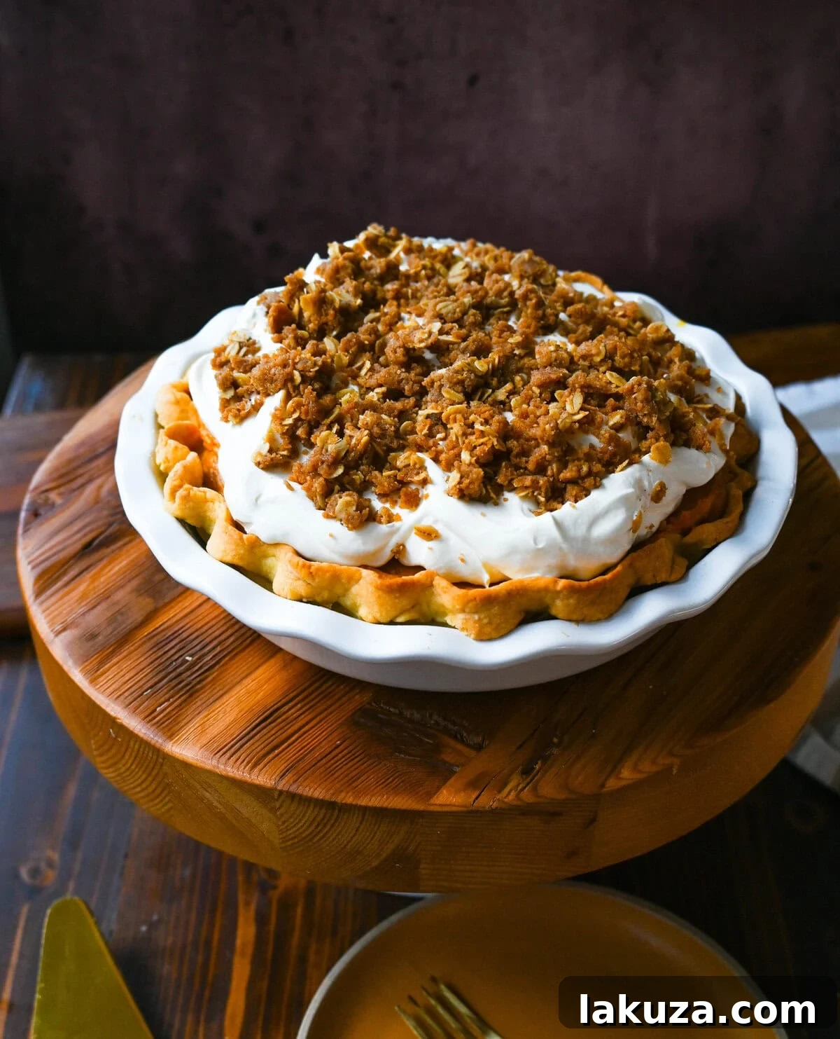 Golden Harvest Hillys Pumpkin Caramel Pie 5 Various ingredients for Milk Bar Pumpkin Caramel Pie, including white chocolate, pumpkin puree, and spices, laid out on a kitchen counter.