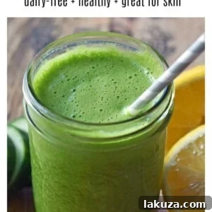 Youthful Glow Green Smoothie. Healthy light and fresh smoothie with greens. Spinach, lemon juice, cucumber, ginger, and banana.