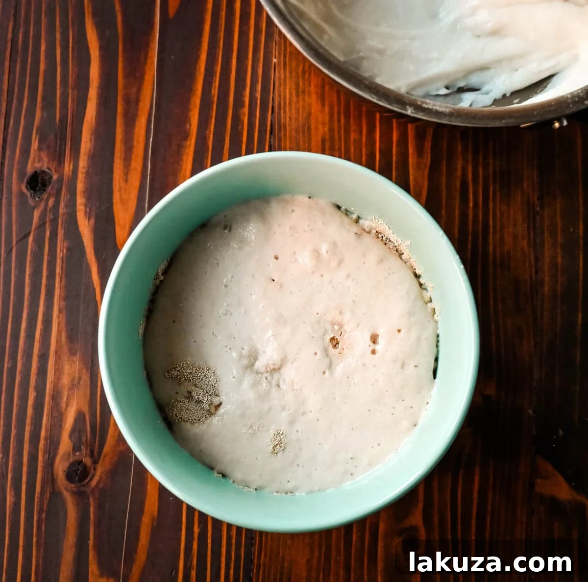 Pillowy Japanese Milk Buns 6 Bubbling yeast mixture, a visual sign that the yeast is active and ready for making Japanese milk bread dinner rolls. This ensures successful rising and a fluffy texture.