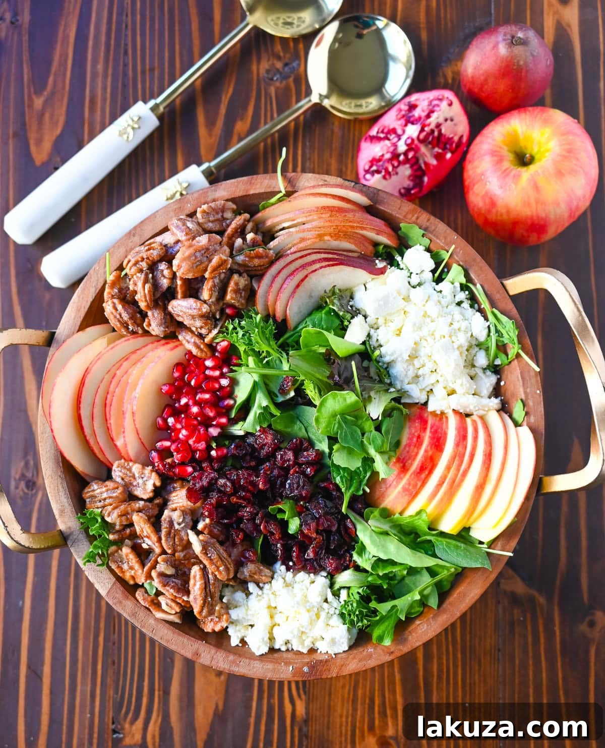 A visually appealing Honeycrisp Apple and Candied Pecan Salad, perfect for autumn gatherings and Thanksgiving. It combines crisp fruits, creamy goat cheese, sweet and crunchy candied pecans, and a tangy homemade maple dressing, truly highlighting the season's best flavors.