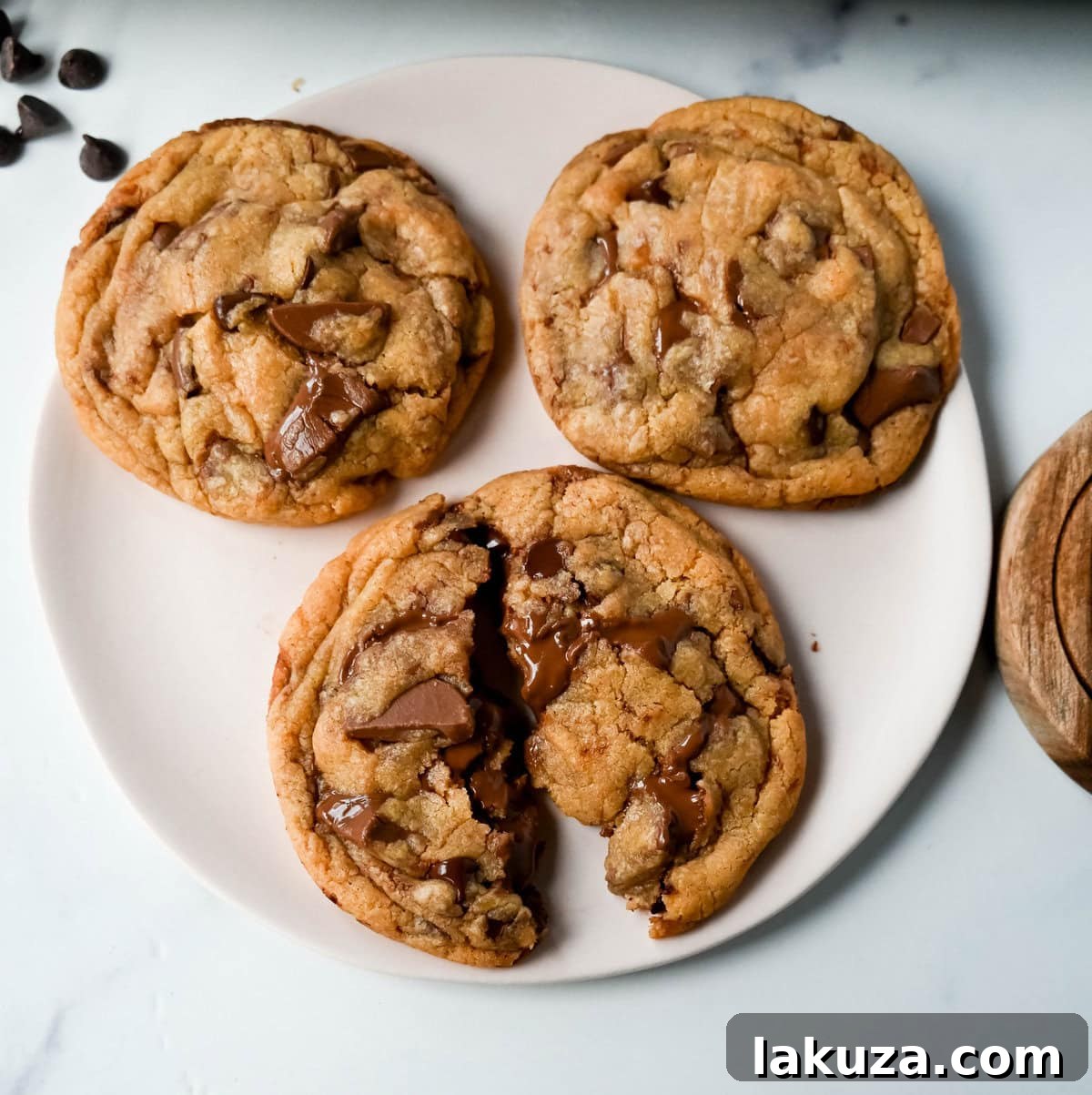 Irresistibly Chewy Condensed Milk Chocolate Chip Cookies 7 Sweetened Condensed Milk Chocolate Chip Cookies arranged on a cooling rack, showcasing their inviting texture and rich chocolate.