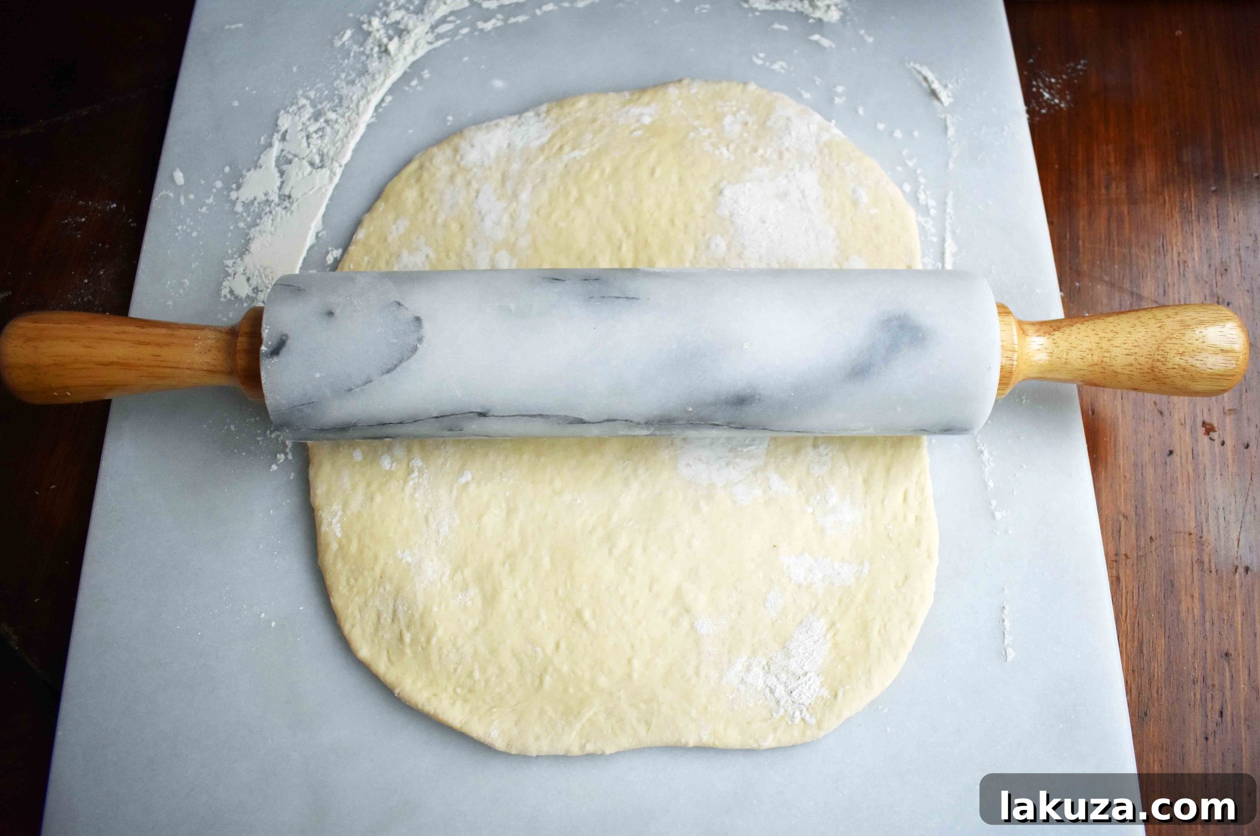 Golden's Savory Garlic Parmesan Cheese Rolls 4 Pizza dough rolled flat, ready for butter and cheese.
