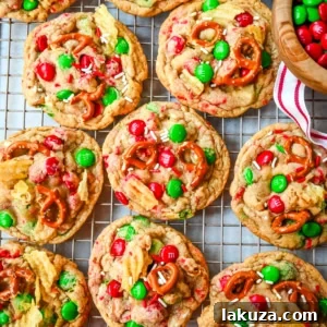 Get ready to bake the ultimate Christmas treat with these Christmas Kitchen Sink Cookies! Packed with holiday M&M's, pretzels, potato chips, sprinkles, and optional chocolate chips, these cookies bring together sweet, salty, and festive flavors in every bite. They're easy to make, fun to customize, and perfect for gifting, cookie swaps, and for your Christmas baking.
