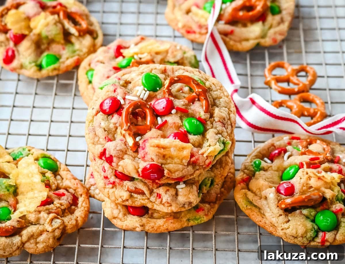 Christmas Cornucopia Cookies 4 Stacked Christmas kitchen sink cookies. Get ready to bake the ultimate Christmas treat with these Christmas Kitchen Sink Cookies! Packed with holiday M&M's, pretzels, potato chips, sprinkles, and optional chocolate chips, these cookies bring together sweet, salty, and festive flavors in every bite. They're easy to make, fun to customize, and perfect for gifting, cookie swaps, and for your Christmas baking.