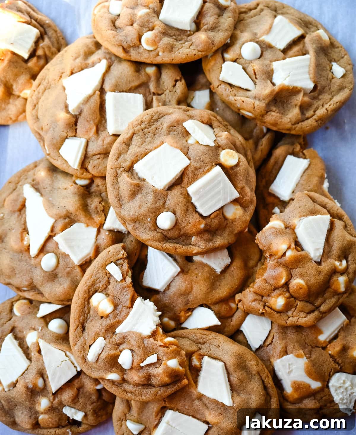 Spiced Ginger Molasses White Chocolate Chunk Cookies 6 Close-up of baked ginger molasses white chocolate chunk cookies, showing the soft interior and melted white chocolate.