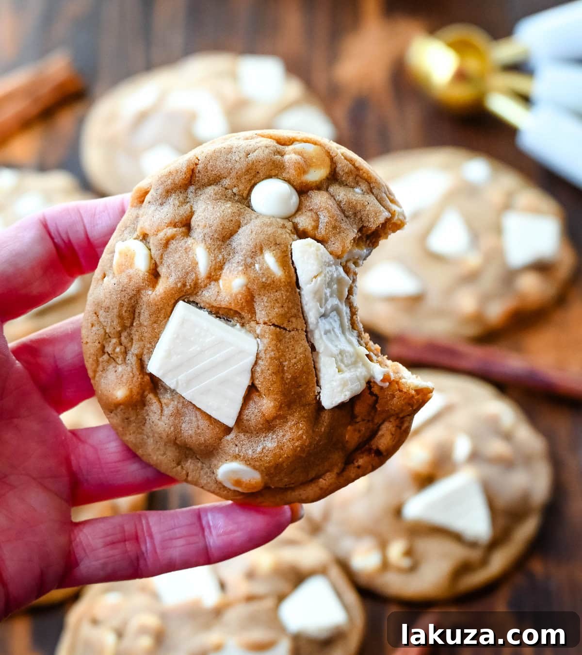 Spiced Ginger Molasses White Chocolate Chunk Cookies 7 Freshly baked ginger molasses white chocolate chunk cookies on a cooling rack, ready to be enjoyed.