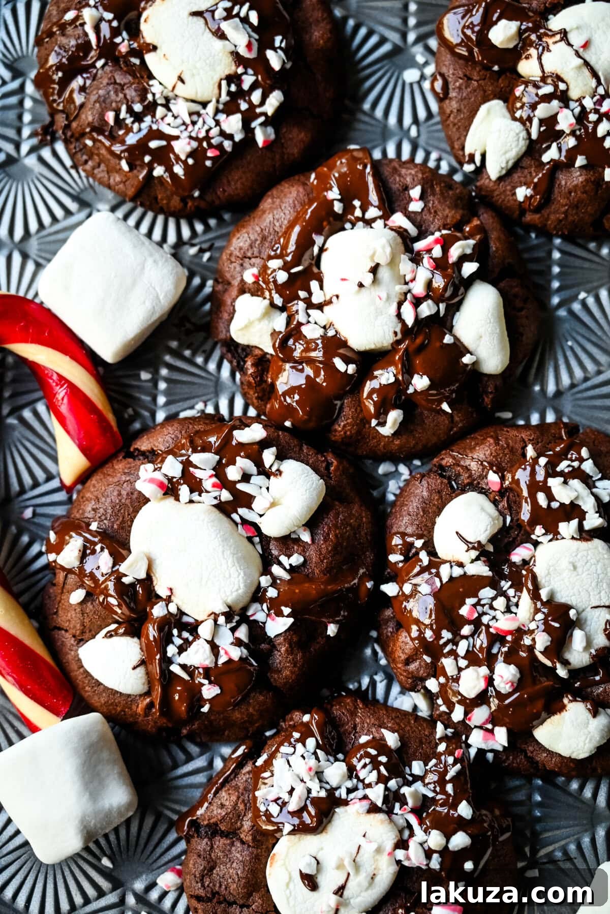 These Hot Cocoa Cookies feature a homemade chocolate cookie base, a gooey marshmallow topping, and a drizzle of melted chocolate for the perfect finishing touch. If you love peppermint, add crushed candy canes and a hint of peppermint extract for Peppermint Hot Cocoa Cookies.