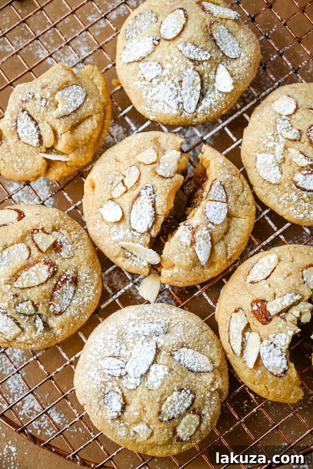 Almond Croissant-Inspired Cookies 5 Assortment of key ingredients for Almond Croissant Cookies, including butter, eggs, flour, and almond extracts.