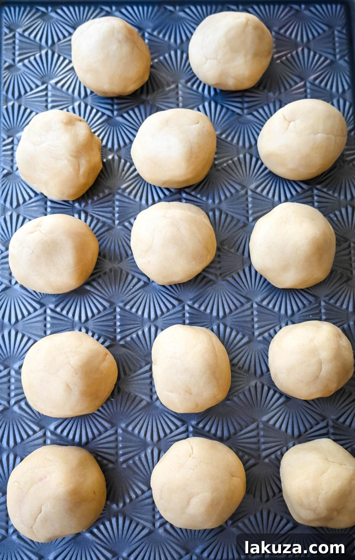 Almond Croissant-Inspired Cookies 6 Close-up of perfectly portioned Almond Croissant Cookie dough balls with almond filling encased.