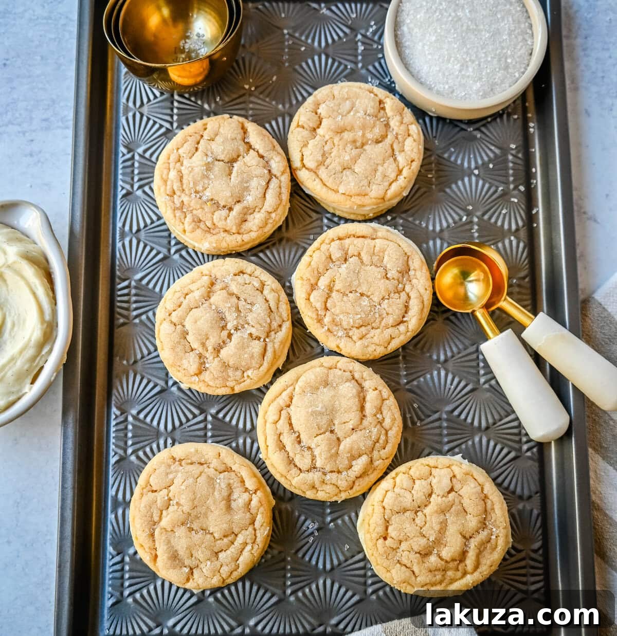 Cream Cheese Frosted Sugar Cookie Sandwiches 5 Assembled Sugar Sandwich Cookies with Cream Cheese Frosting, showing the creamy filling perfectly spread to the edges.