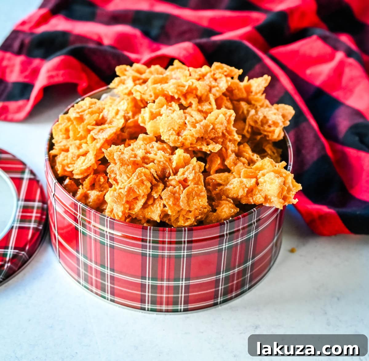 Cornflake Crunch or Cornflake Crack nestled in a festive Christmas tin, making a perfect homemade holiday treat.