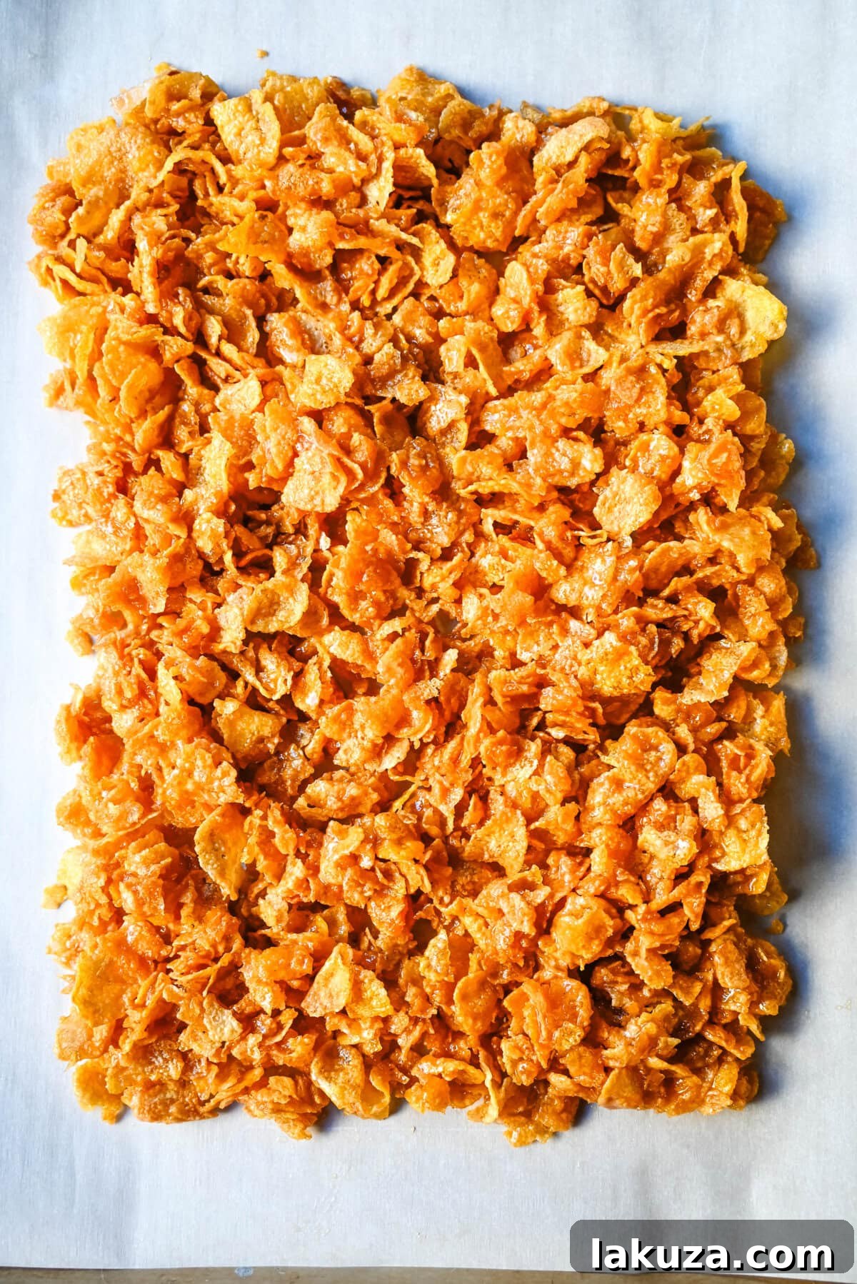 Ingredients for Cornflake Crack laid out: cornflakes, butter, brown sugar, and optional chocolate and sea salt flakes.