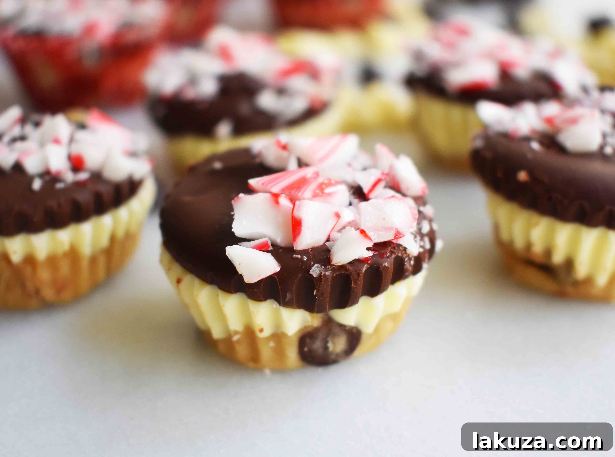 Delicious Peppermint Bark Cookie Dough Cups arranged on a festive holiday platter, topped with crushed candy canes.