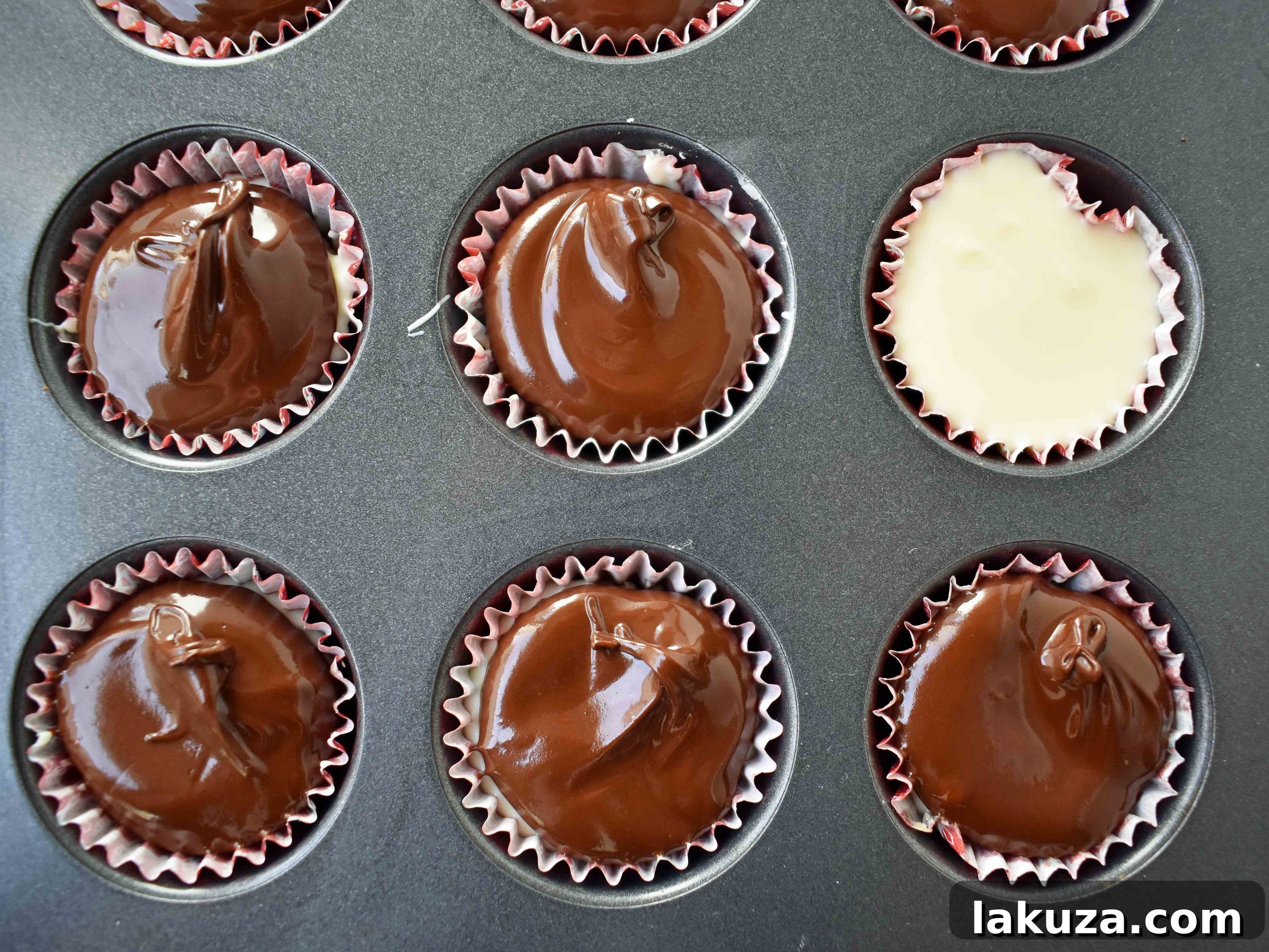 A tray filled with freshly made Peppermint Bark Cookie Dough Cups, ready to be chilled and enjoyed.