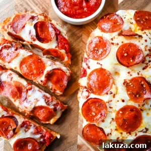Homemade French Bread Pizzas with garlic butter, mozzarella cheese, and pepperoni.