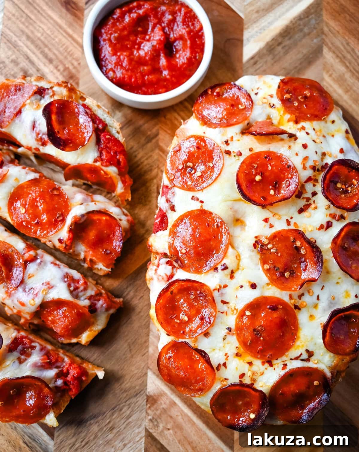 Crispy French Bread Pizzas 7 Stacked slices of freshly baked French bread pizza, showcasing the crispy crust and melted cheese.