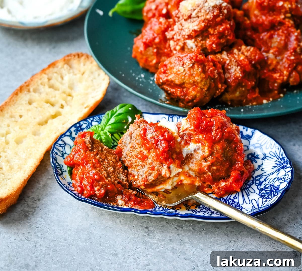 Hand rolling a perfect Ricotta Parmesan Meatball mixture, showcasing the soft and pliable texture.