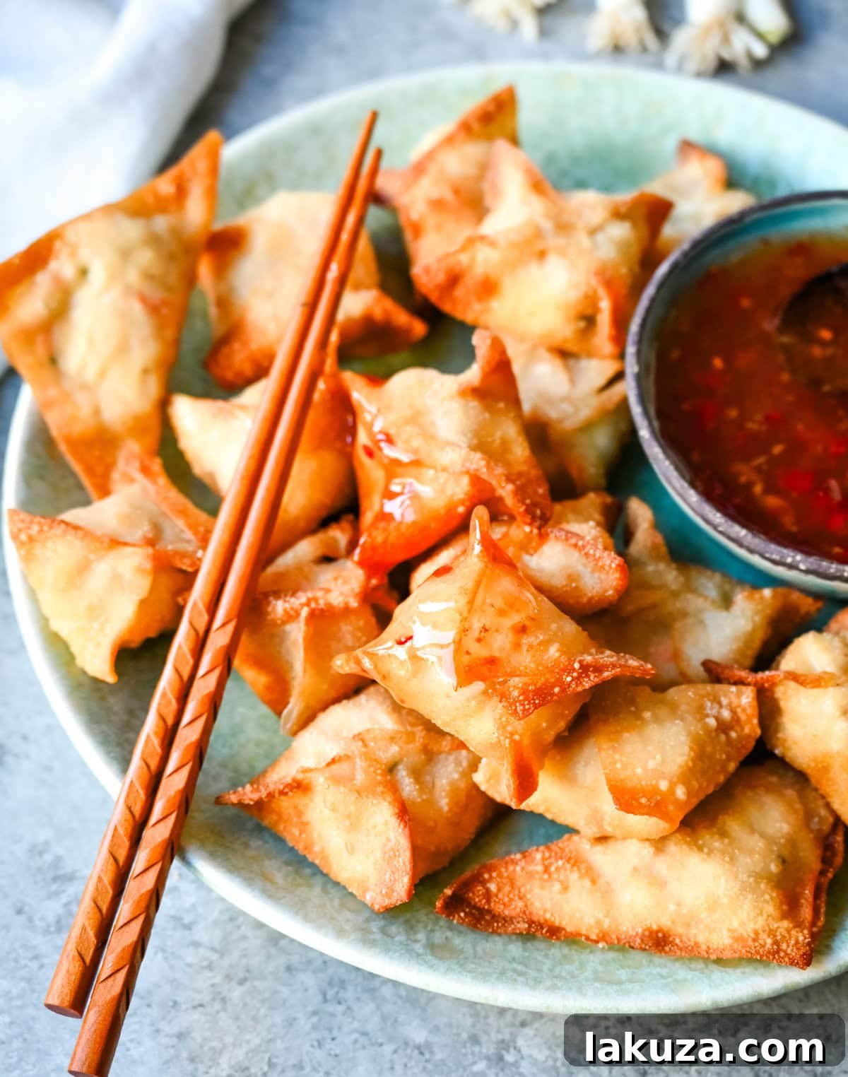 Crispy Crab Rangoon appetizer, also known as crab wontons, filled with creamy crab and cream cheese mixture, perfect for any gathering.
