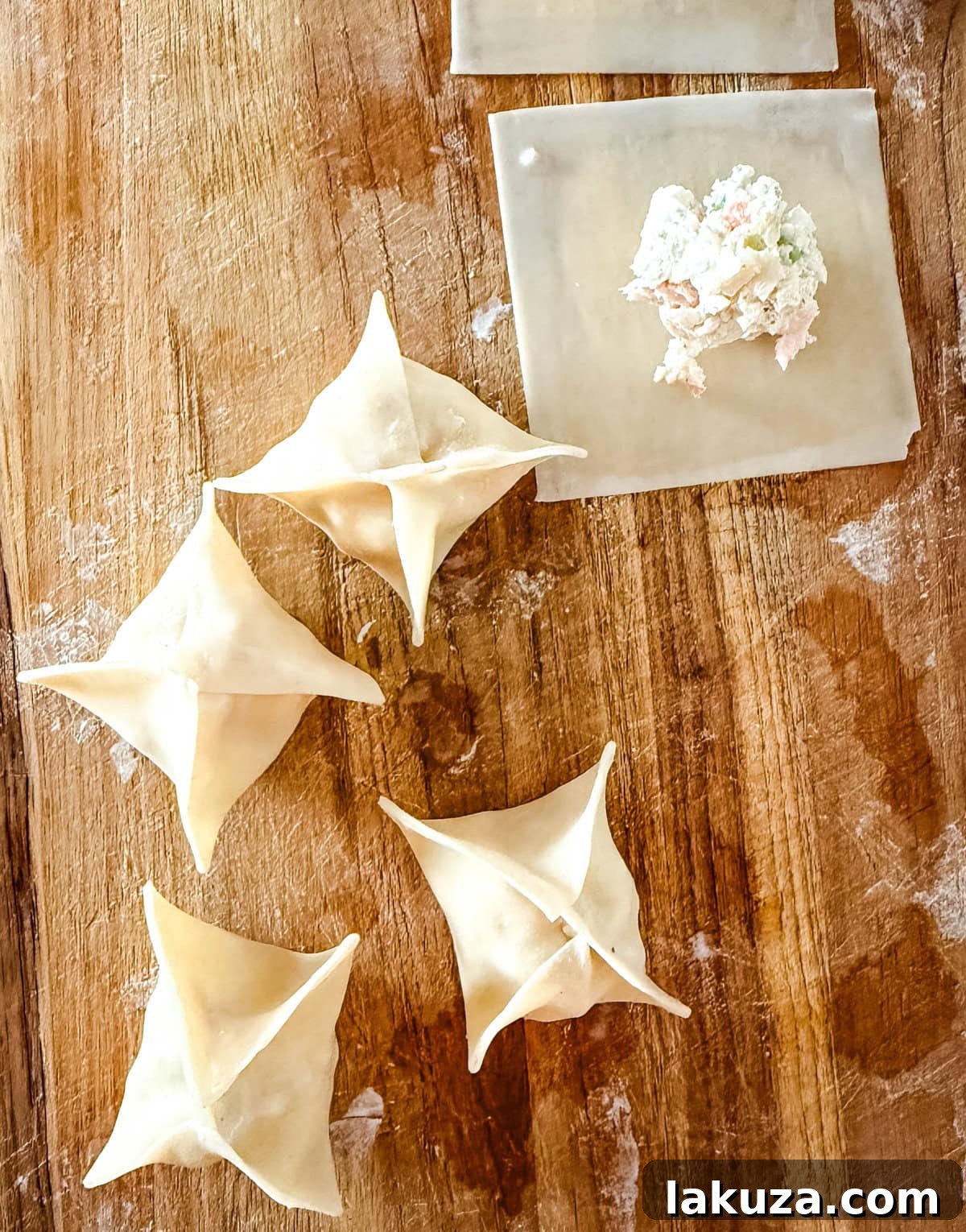 Step-by-step process of sealing wonton wrappers for making Crab Rangoon, demonstrating proper folding and sealing techniques.