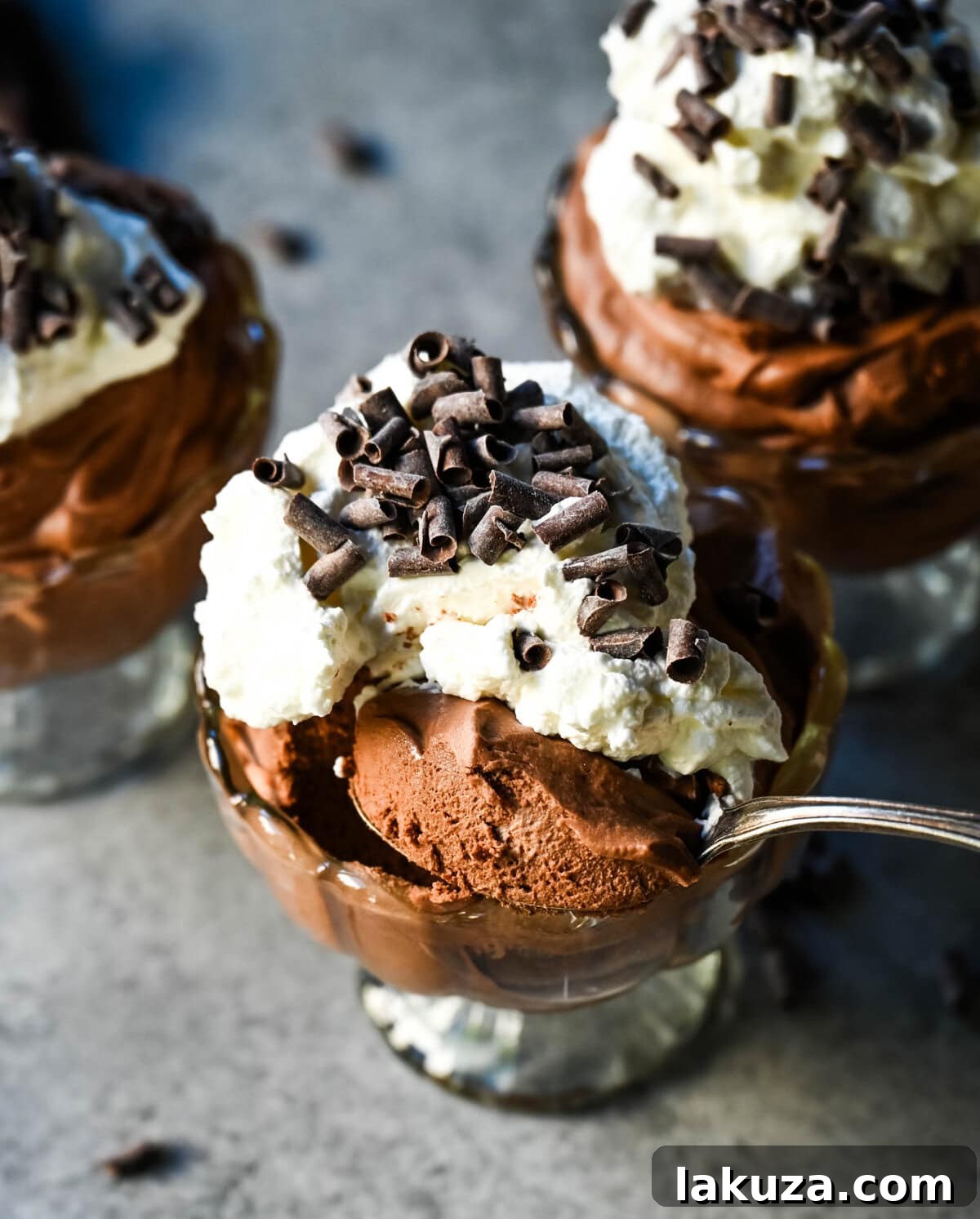 A close-up of the smooth, rich chocolate mousse mixture, before being chilled, showcasing its luxurious texture.
