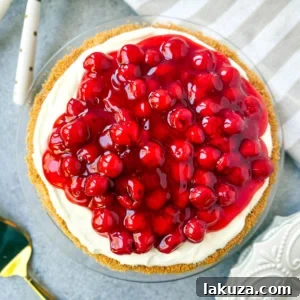 A No-Bake Cheesecake with sweetened condensed milk, topped with a luscious fruit sauce.