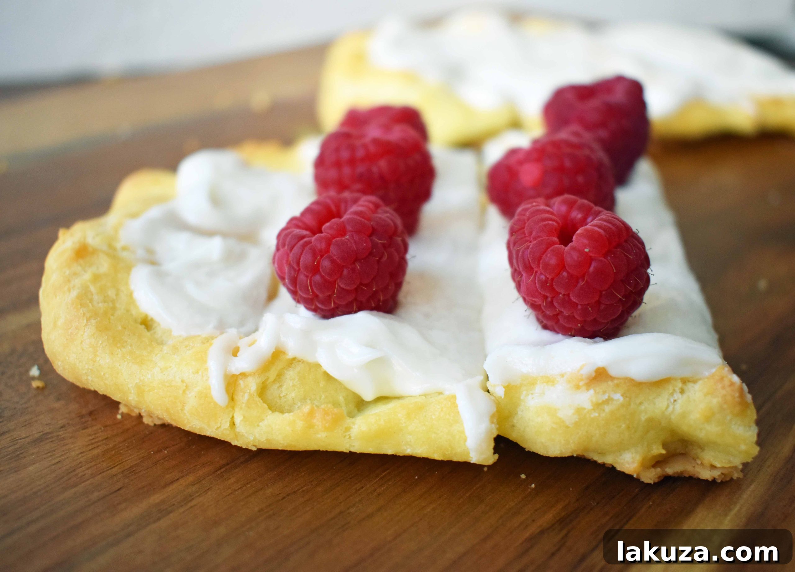 Swedish Pastry by Modern Honey. Buttery flaky layers with almond filling and topped with sweet cream frosting. A popular homemade European pastry.