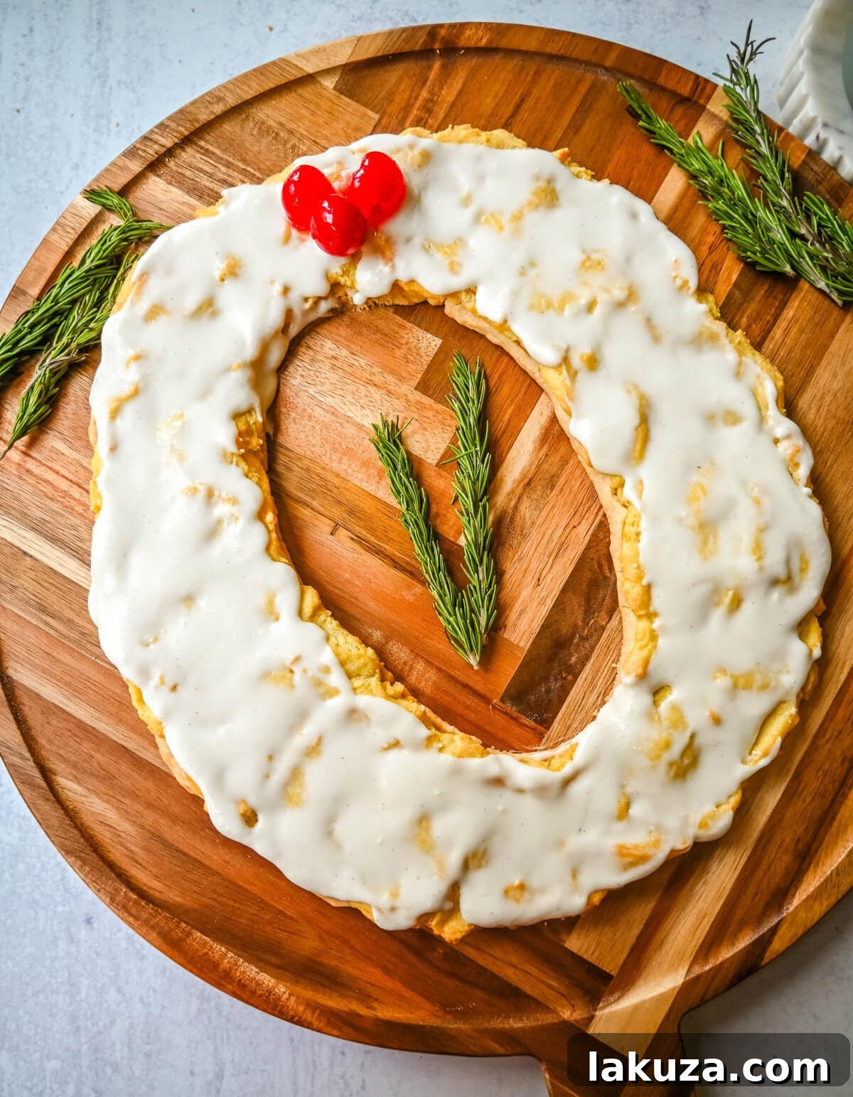 This homemade Swedish Pastry, also known as Danish Kringle, features a buttery crust, an almond filling, and topped with an almond frosting. This buttery pastry is buttery, creamy, and has just the right sweetness. A holiday tradition! Danish Kringle wreath